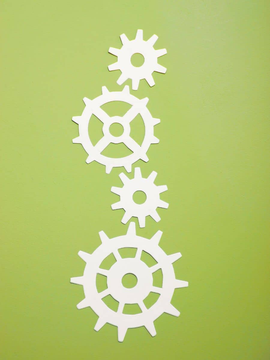 paper gears on a green background